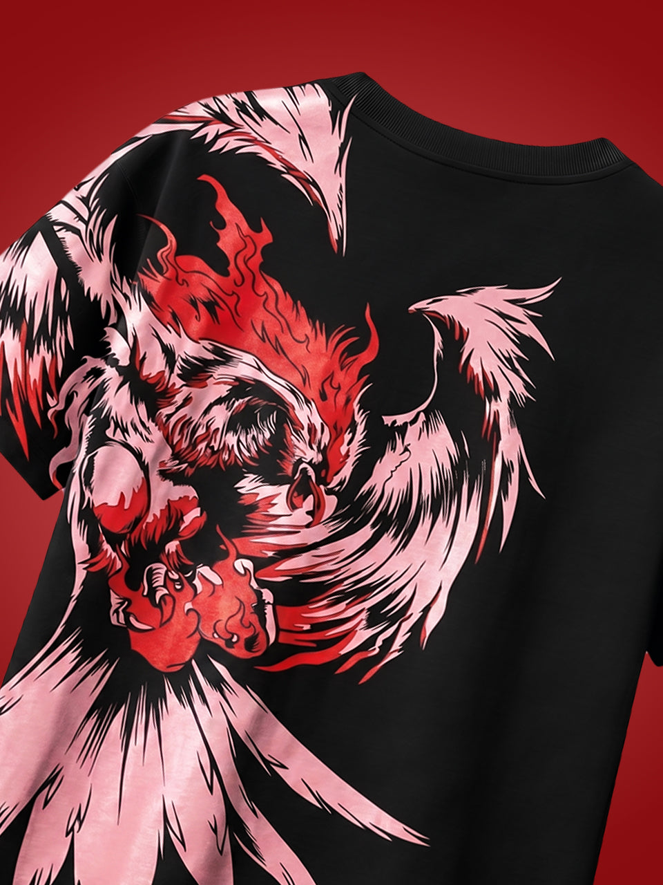 Close-up of eagle phoenix screen print on back of black Naram oversized tshirt — red flame and pink feather detail