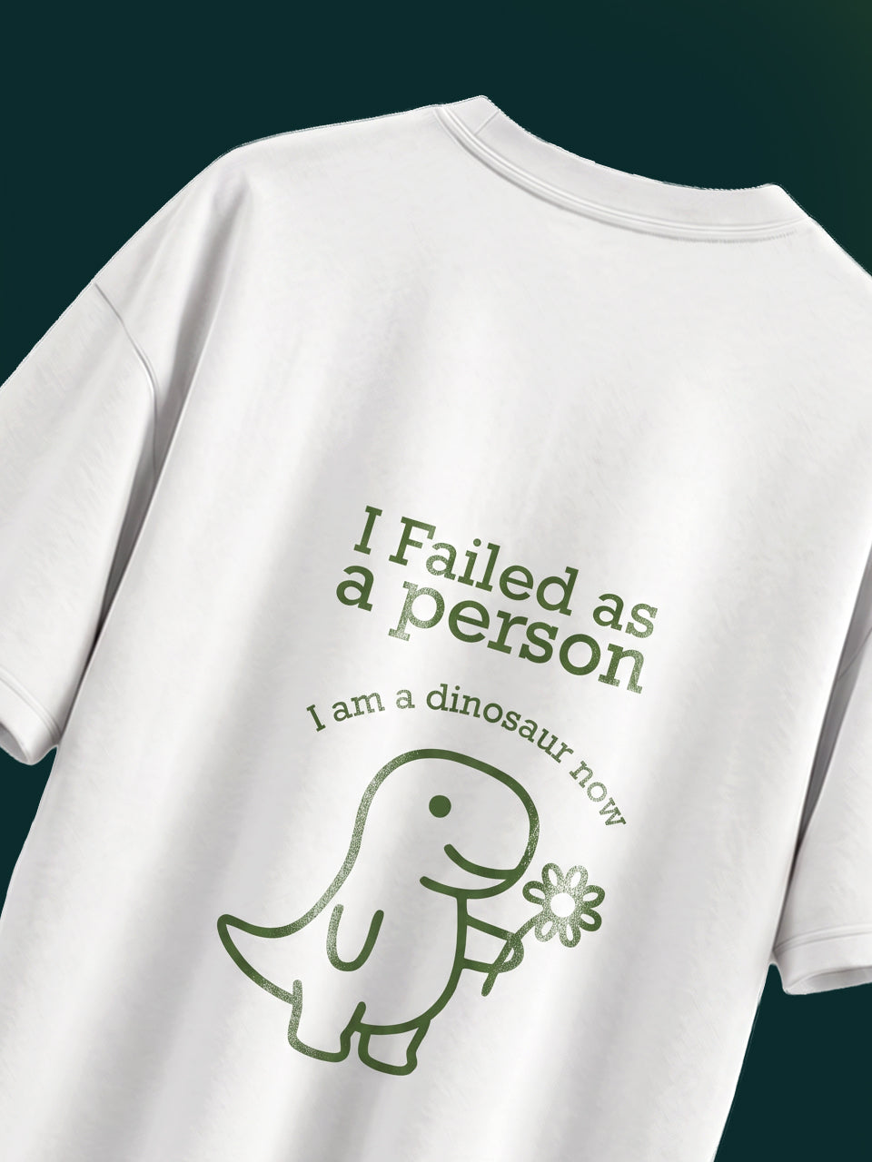 Naram I Failed as a person dinosaur tee back graphic flatlay forest green dinosaur print white tee