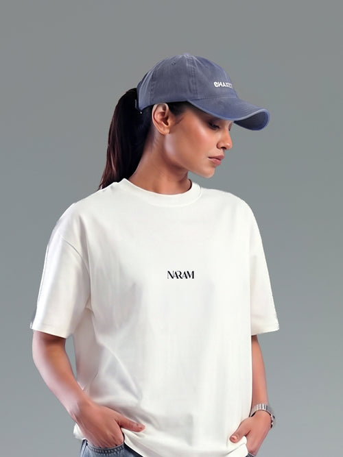 Woman wearing Naram oversized beige t-shirt with cap minimal Indian streetwear brand