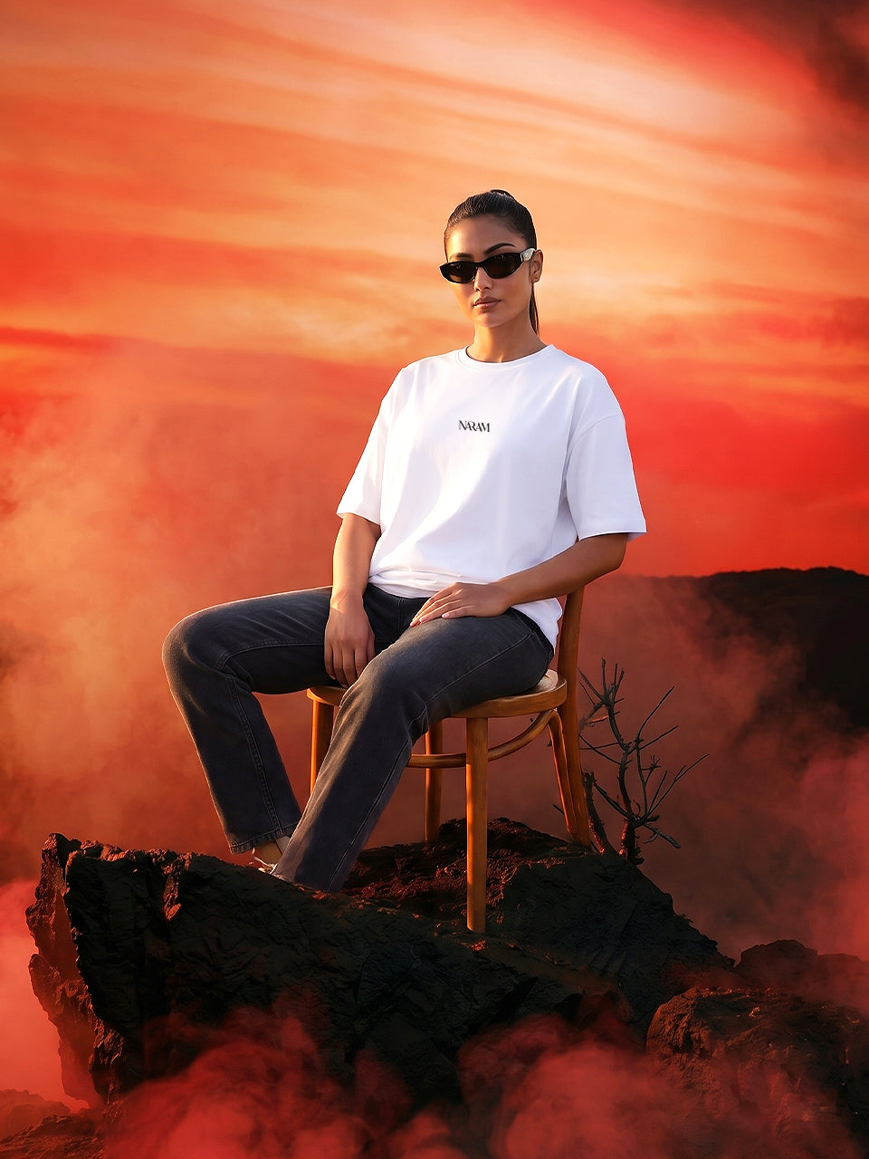 Naram Ignoring All Redflags oversized white t-shirt woman seated front view dramatic sunset Indian streetwear